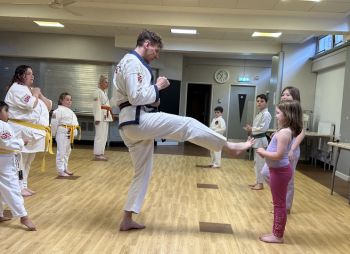 Master Fowden demonstrating a kick